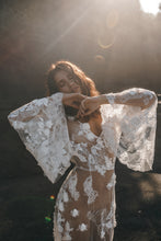 Load image into Gallery viewer, BOHO bride with both arms up to show off bell sleeves of lace wedding dress.