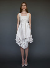 Load image into Gallery viewer, Model posing full length wearing short, belted, A-line wedding dress with straps.
