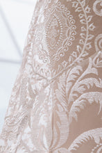 Load image into Gallery viewer, Close up shot of lace at back hip of gown. Showcasing that the sheath slip is tighter than the lace overlay.