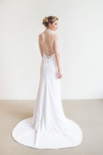 Load image into Gallery viewer, Model, full length from behind, wearing V-neck lace up backless crepe wedding dress.
