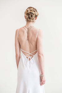 A strappy lace up low back wedding dress made in Vancouver