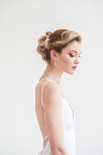 Load image into Gallery viewer, A plunging V-neck trumpet wedding dress in crepe .