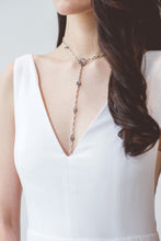 Load image into Gallery viewer, A minimalist wedding dress with sexy low V front and mesh side cut uniquely made in Vancouver.
