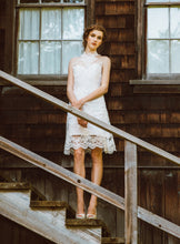 Load image into Gallery viewer, models standing on stairs wearing a high neck lace wedding dress.