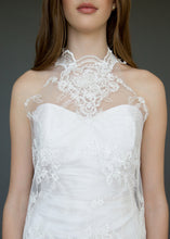 Load image into Gallery viewer, Close up of torso of strapless wedding dress with high neck lace overlay in a short version.