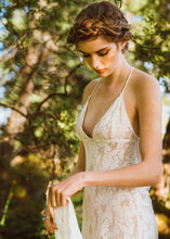 Load image into Gallery viewer, A unique low V neck open back lace bridal gown made in Vancouver. 
