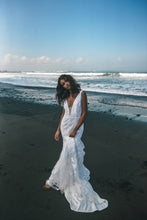 Load image into Gallery viewer, Bride posing on beach with sleeveless wedding dress in lace with trumpet skirt.