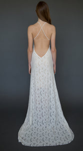 A romantic lace wedding dress made with stretch lace that is affordable and boho chic.