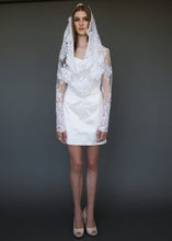 Load image into Gallery viewer, Model standing, in short wedding dress and lace cropped jacket.
