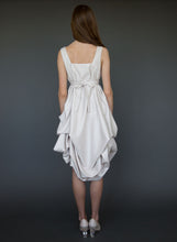 Load image into Gallery viewer, Model full length facing away, wearing greek style short wedding dress.
