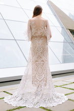 Load image into Gallery viewer, Romantic bride in a full length back view wearing vancouver wedding dress boutiques Elle dress, a lace long sleeve wedding dress.
