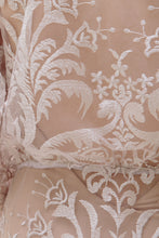 Load image into Gallery viewer, Detail shot of lace on back of vancouver bride showing unusual embroidery for unique wedding dresses.
