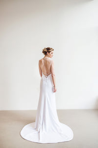 An open back corset crepe wedding dress with mermaid skirt