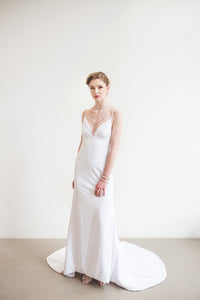 a mermaid crepe wedding dress with low back and V-neck front.