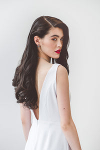 A minimalist sleeveless wedding dress with low V back that is bra friendly, uniquely made in Vancouver. 