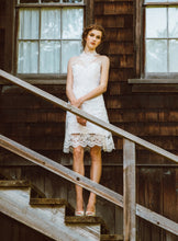 Load image into Gallery viewer, models standing on stairs wearing a high neck lace wedding dress.
