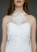 Load image into Gallery viewer, Close up of torso of strapless wedding dress with high neck lace overlay in a short version.
