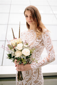 Side view of bridal bouquet of boho bride wearing Vancouver designer fit-and-flare lace wedding dress.