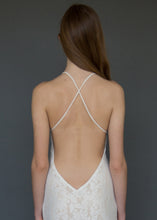 Load image into Gallery viewer, A strappy cross over backless lace bridal gown uniquely made in Vancouver. 
