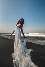 Load image into Gallery viewer, Vancouver bride dancing on beach holding skirt of low back lace wedding dresses.

